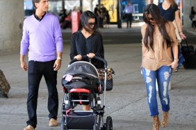 Kourtney Kardashian, black top, diaper bag, stroller, kim kardashian, ripped jeans, animal print boots, beige top, brown shirt, scott disick, lavendar sweater,